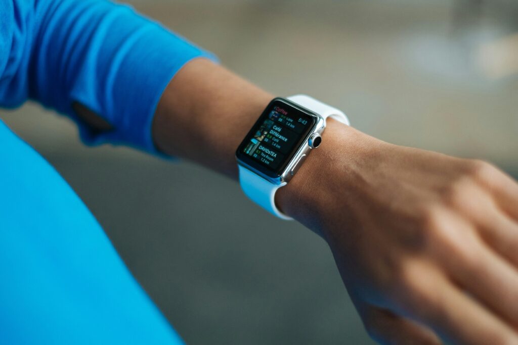 woman checking smartwatch for exercise statistics